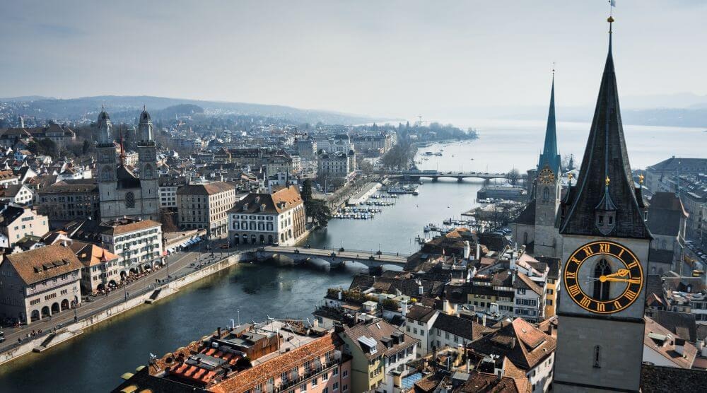 Zürich's old town along the Limmat, Grossmünster on the left, St. Peter's clock tower on the right.